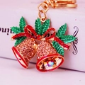 Exquisite Christmas bell keychain with red bow, rhinestones and green leaf design - Peach