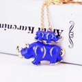 Blue enamel rhino mother and child keychain with gold plating and sparkling crystals - Dark Blue
