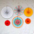 Set of 6 colorful paper fans with dots and stripes hanging on a white brick wall - Rainbow with White Dots