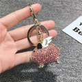 Pink rhinestone flying pig keychain with golden metal ring and white wings detail - Basic Style / Pink