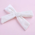 Detail showing high-quality white velvet texture and handmade bow design for hair clips - White