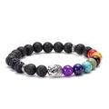 Macro shot of lava stone 7 chakra bracelet with silver Buddha head and colored beads - Buddha Head - Antique Silver