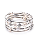 Multilayer wrap bracelet featuring white pearls and silver metal beads on white background - Shell Pearl Style