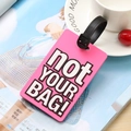 Pink PVC suitcase tag with bold 'not YOUR BAG!' text and adjustable black strap - Pink
