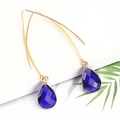 Elegant gold drop earrings featuring blue faceted teardrop crystals on long hooks - Blue