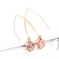 Elegant gold drop earrings featuring faceted pink teardrop crystals on slim ear hooks - Champagne Pink
