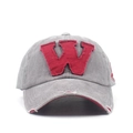 Detailed close-up of vintage washed cotton baseball cap with distressed brim and red W patch - Adjustable / Light Gray