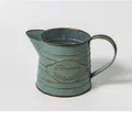 Vintage teal blue metal flower pitcher with embossed Flowers plaque and ribbed texture - Style E