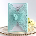 Detail of laser-cut butterfly invitation with intricate lace texture and white insert card - Light Blue Pearlescent