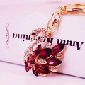 Golden swan keychain pendant with clear rhinestones and large red marquise crystals - Purple