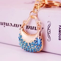 Portachiavi creativo dorato con borsa in strass blu e ciondoli per rossetto chic - Blu