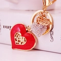 Golden keychain with red enamel heart, rhinestone charm and rose flower pendant - Red