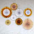 Set of 8 gold and white decorative paper fans with stripes and dots on a white brick wall - Gold Foil 8pcs Set