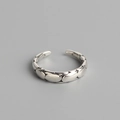 Minimalist S925 sterling silver open ring with irregular faceted texture on grey background - Retro Irregular Hammered Style (TYJ0116)