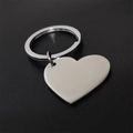 Polished heart-shaped stainless steel keychain for DIY engraving on black background - Inner Hole Heart Shape