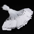 Bulk rectangular white paper jewelry price tags with strings on a black background - Blank Rectangle 2.3cmX1.3cm