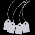 Close-up of four white rectangle paper jewelry price tags with cotton strings on black background - Blank Rectangle 2.4cm*1.5cm