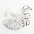 Close-up of bulk white paper jewelry price tags with silver border and cotton strings - Silver-Rimmed Label / 100pcs Pack / Silver