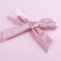 Close-up of a pink velvet bow hair clip with fine texture and silver alligator clip - Dusty Pink