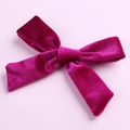 Detail shot of the plush magenta velvet fabric and handmade knot on the 5-inch hair bow - Fuschia