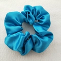 Lustrous blue satin scrunchie with soft pleated texture and elegant silk sheen - Sky Blue
