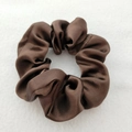 Close-up of brown satin scrunchie showing smooth texture and glossy finish on white background - Brown