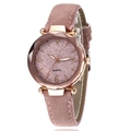 Detail view of a pink minimalist quartz watch with leather strap and classic dial - Pink