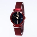 Detailed shot of red mesh strap watch with starry blue dial and classic stripe detail - Red