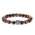 Detail of tiger eye bead bracelet featuring a silver owl charm and vintage metal spacers - Owl / Antique Silver