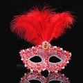 Elegant red masquerade mask with vibrant feathers and a central ruby gemstone for parties - Red