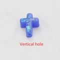 Macro view of blue synthetic opal cross bead with vertical hole and fiery luster - Blue No.6 - Vertical Hole