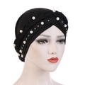 Close-up of black turban hat with braided band and elegant white pearl embellishments - Black