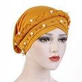 Ginger yellow turbans cap for women with braided twist design and white pearl accents - Turmeric
