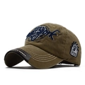 Detailed view of New York 3D embroidery and planet logo on a washed khaki baseball cap - Khaki