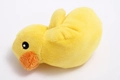 Detailed close-up of a yellow plush duck toy with soft texture and embroidered eyes - Small Yellow Duck