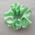 Detail of green satin silk scrunchie with high elasticity and elegant pleated fabric texture - Mint Green