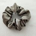 Close-up of grey satin scrunchie showing smooth silk texture and elegant fabric folds - Silver Gray