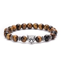 Macro detail of natural brown tiger eye beads with silver leopard head and spacer beads - Leopard Head / Antique Silver