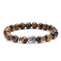 Detailed close-up of natural tiger eye stone beads and silver Buddha head on the bracelet - Buddha Head / Antique Silver