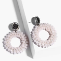 Detailed shot of bohemian white beaded hoop earrings with rhinestone studs on a geometric stand - erp45 Beige