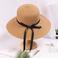 Khaki straw sun hat with long black satin ribbon bow on wooden stand display - Adjustable / Brown (Black Bow)