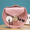 Detailed macro view of pink PU leather coin purse with leaf life tree embroidery and gold clasp - Pink