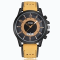 Close-up of SOKI sports watch with yellow suede strap, date window and black numeric dial - Khaki