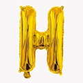 Close-up of a 32-inch golden letter H foil balloon with glossy metallic finish - Letter H