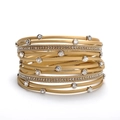Detailed macro view of multi-layer golden leather bracelet with crystal rhinestone inlay - Gold