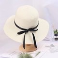 Wide brim straw hat in cream white with black silk ribbon bow on a wooden stand - Adjustable / Cream White (Black Bow)