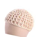 Detail of a beige handmade crochet hairnet with mesh bow design on a mannequin head - Beige