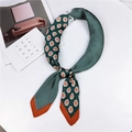 Elegant emerald green silk scarf with polka dots and orange floral patterns laid flat - 70*70cm / Four Grids Floral Green