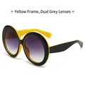 Lunettes de soleil rondes oversize tendance en contraste jaune et noir avec verres dégradés - Monture Jaune Verres Gris Dégradés