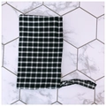 Close-up of black and white checkered fabric phone pouch with matching wrist strap - Black With White Grid